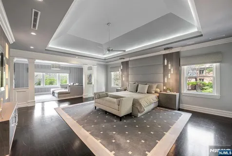 a living room with furniture window and wooden floor
