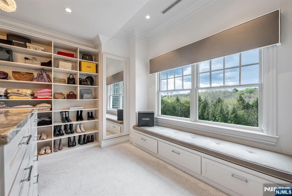 236 East Saddle River Road Saddle River, NJ 07458 - Photo 31 of 50 a view of an empty room with a window and a kitchen