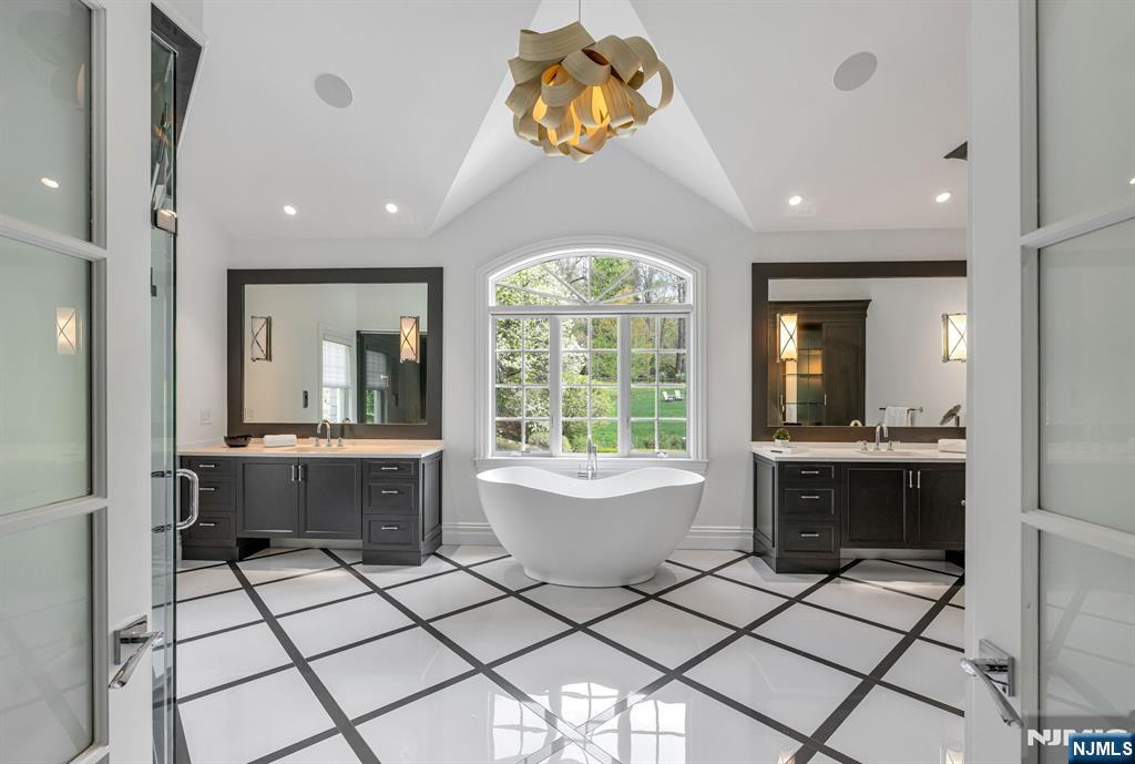 236 East Saddle River Road Saddle River, NJ 07458 - Photo 32 of 50 a large bathroom with a large tub and sink