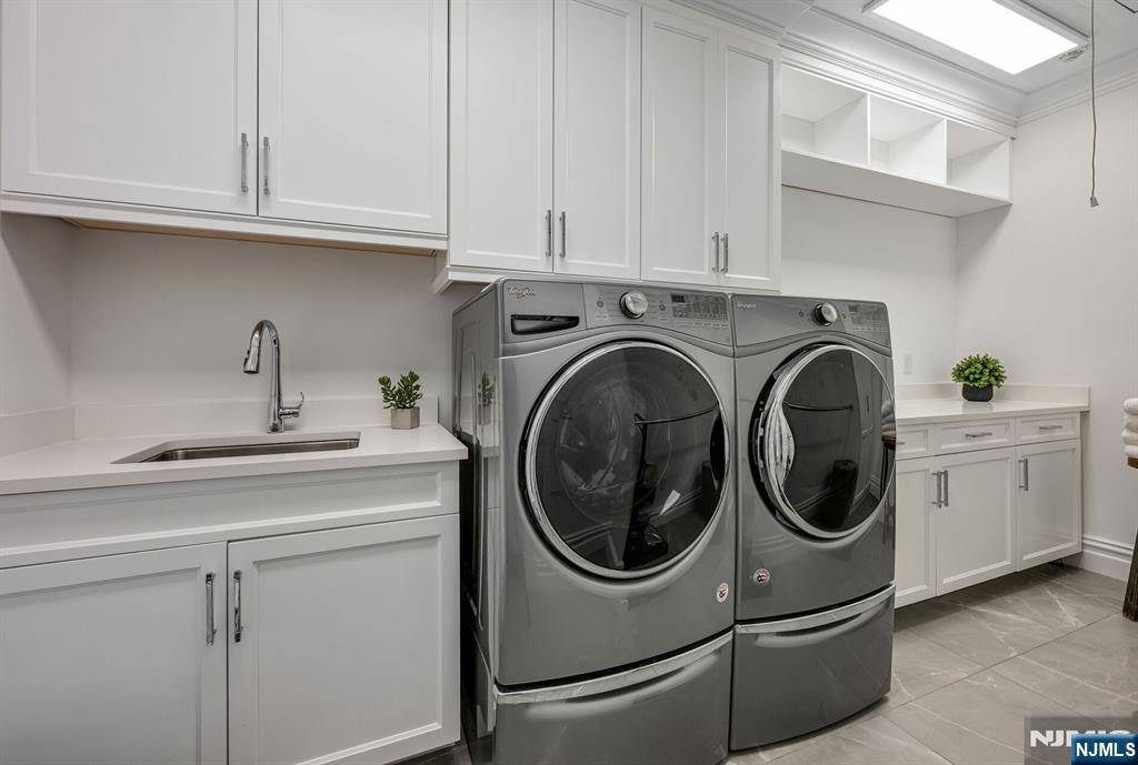 236 East Saddle River Road Saddle River, NJ 07458 - Photo 39 of 50 a utility room with sink dryer and washer