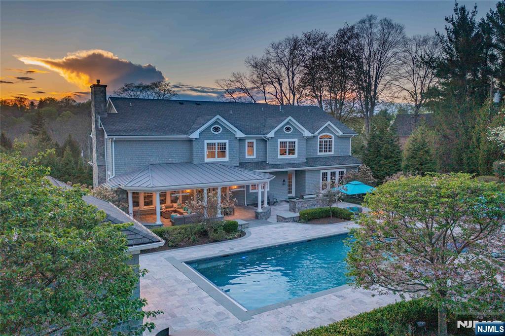 236 East Saddle River Road Saddle River, NJ 07458 - Photo 46 of 50 front view of a house with a yard