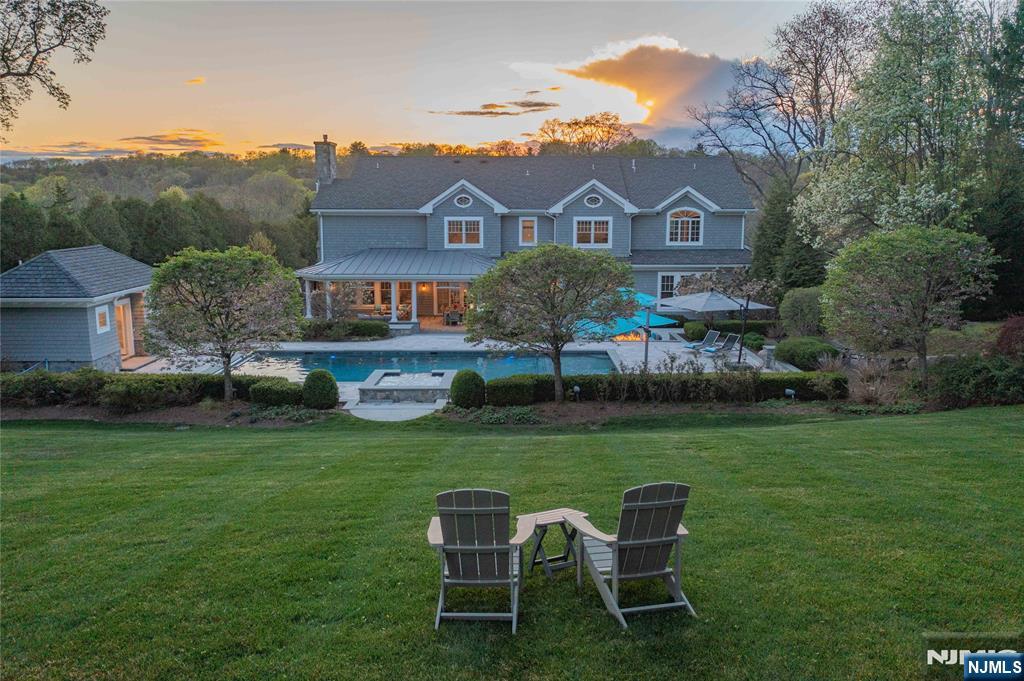 236 East Saddle River Road Saddle River, NJ 07458 - Photo 5 of 50 a view of a chair and table in the garden
