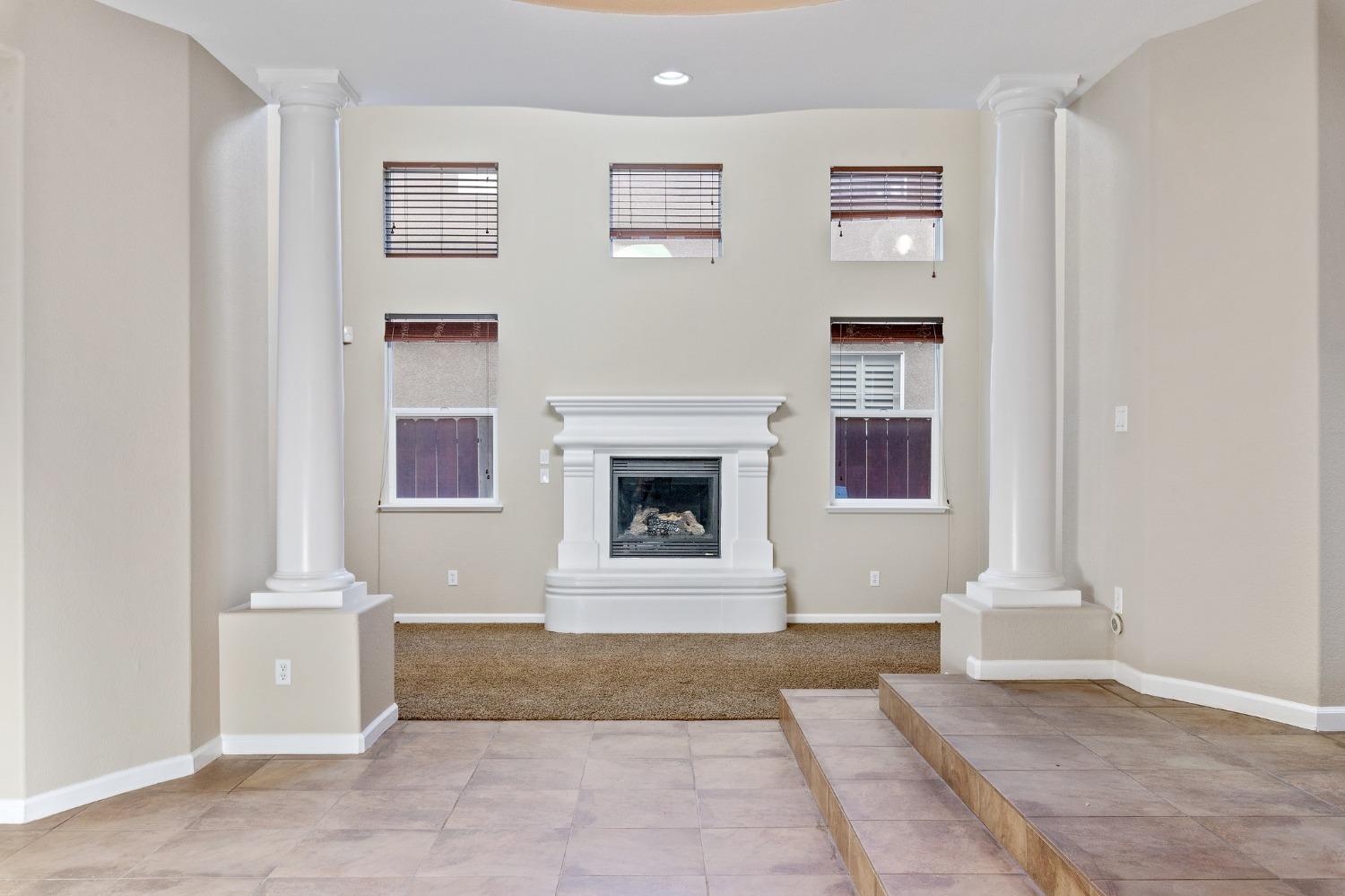 2090 Wisteria Place Manteca, CA 95337 - Photo 12 of 78 a front view of a house with white fireplace