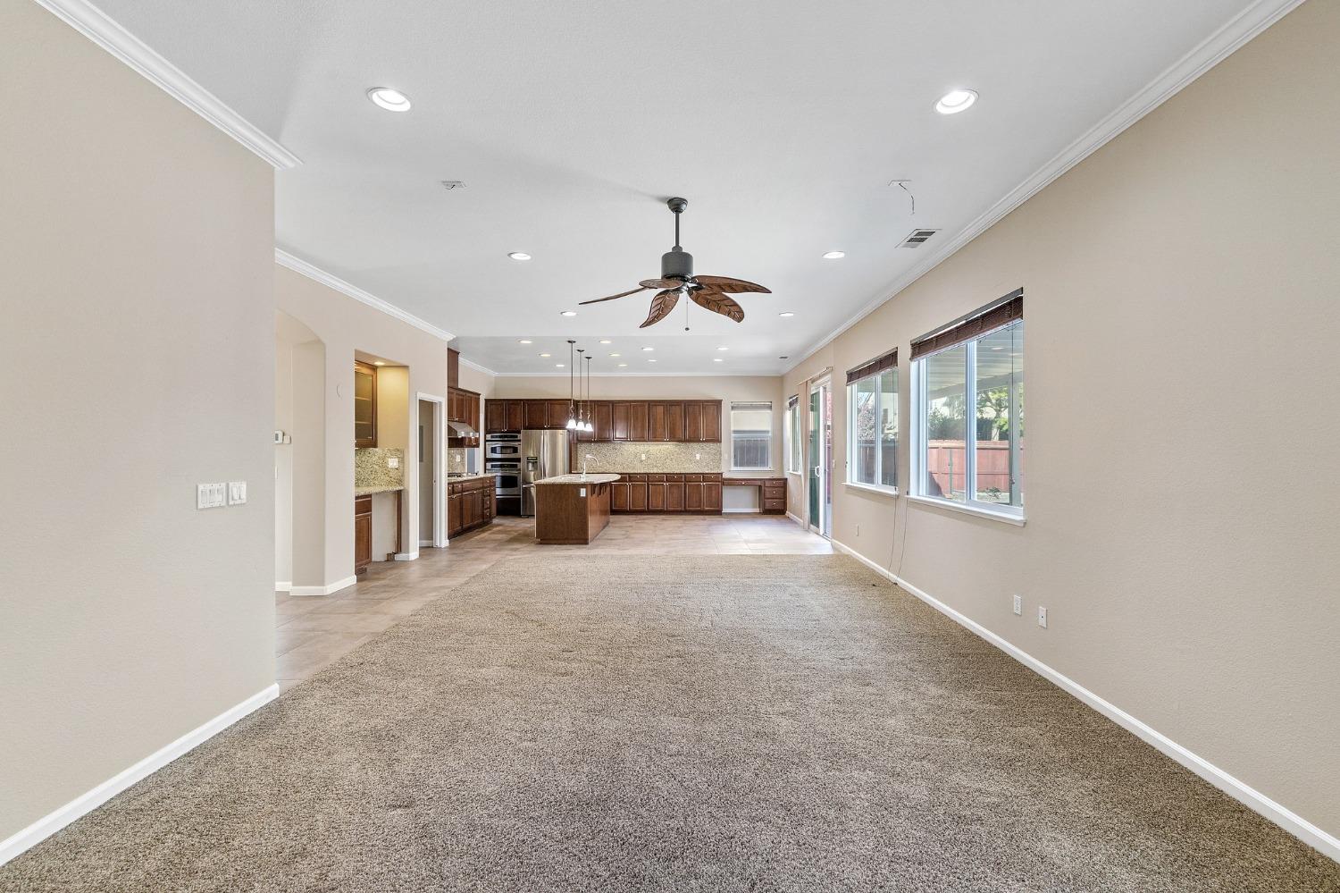 2090 Wisteria Place Manteca, CA 95337 - Photo 28 of 78 a view of a livingroom with furniture cabinet and window