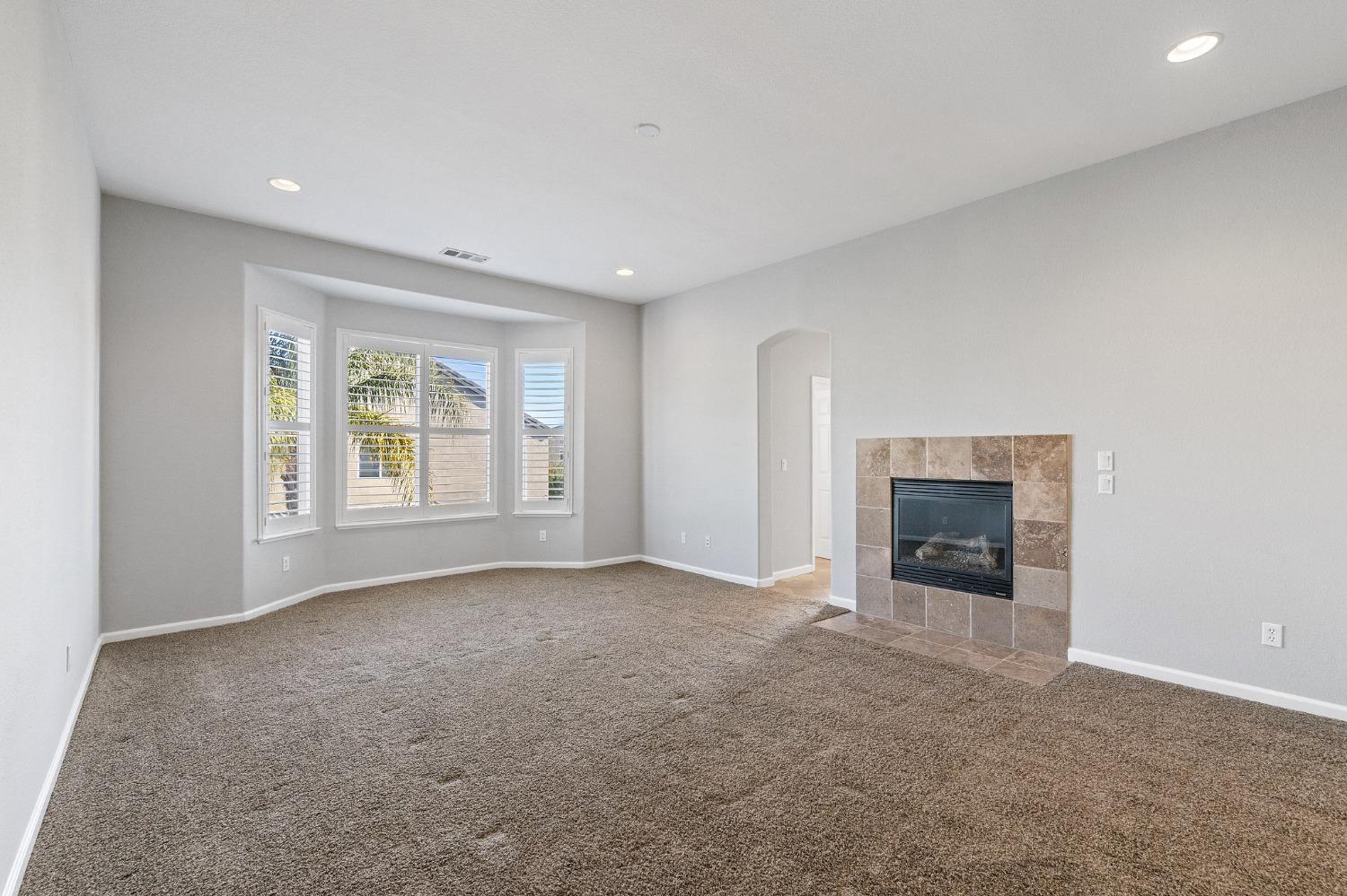 2090 Wisteria Place Manteca, CA 95337 - Photo 34 of 78 an empty room with windows and fireplace
