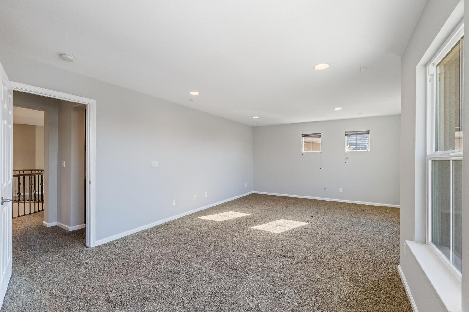 2090 Wisteria Place Manteca, CA 95337 - Photo 45 of 78 an empty room with a empty space and windows