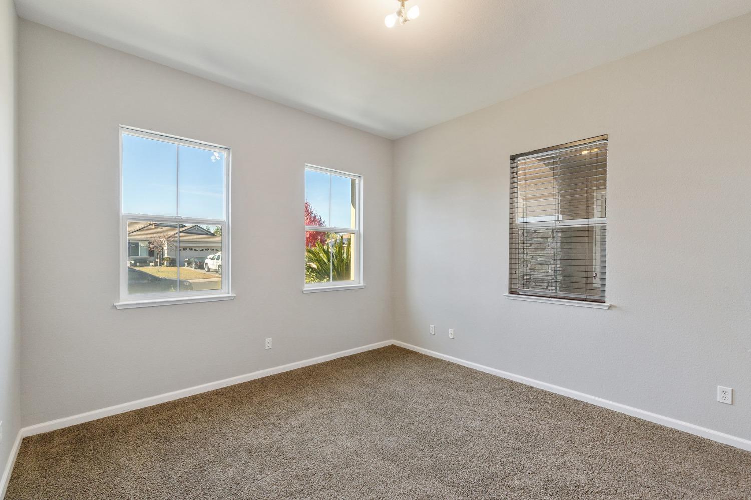 2090 Wisteria Place Manteca, CA 95337 - Photo 62 of 78 an empty room with windows