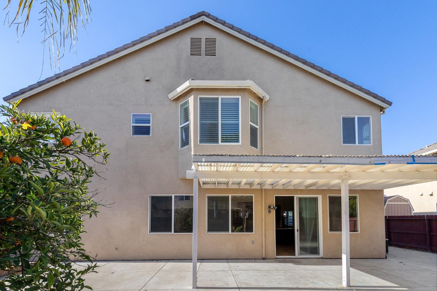 2090 Wisteria Place Manteca, CA 95337 - Photo 74 of 78 a front view of a house with a yard