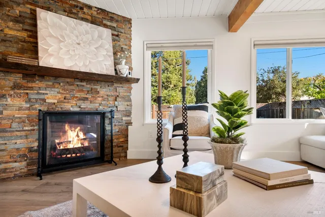 a bathroom with double vanity sink a mirror and shower