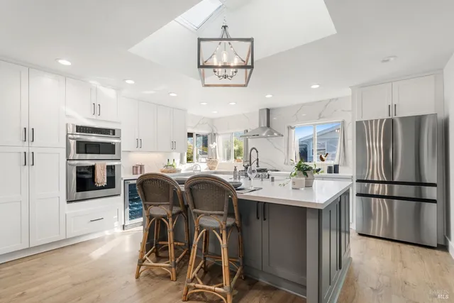 a bedroom with a large bed and a flat screen tv