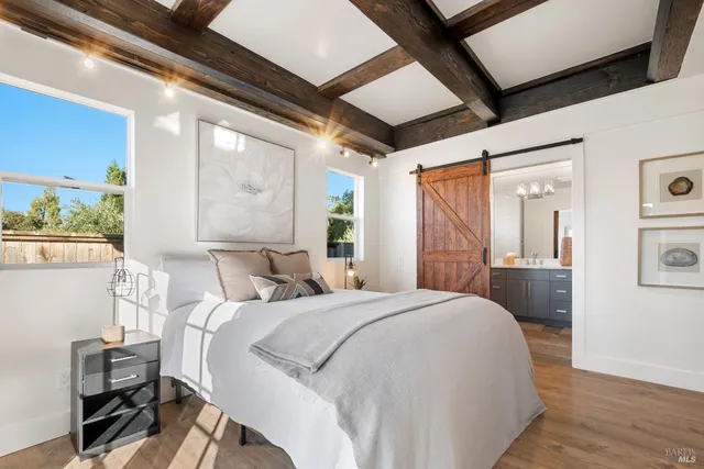 a bedroom with a bed and a table