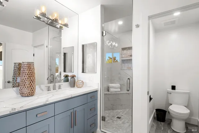 a view of a patio with table and chairs and wooden floor