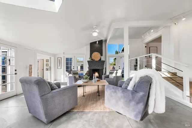 a view of a house with backyard porch and sitting area