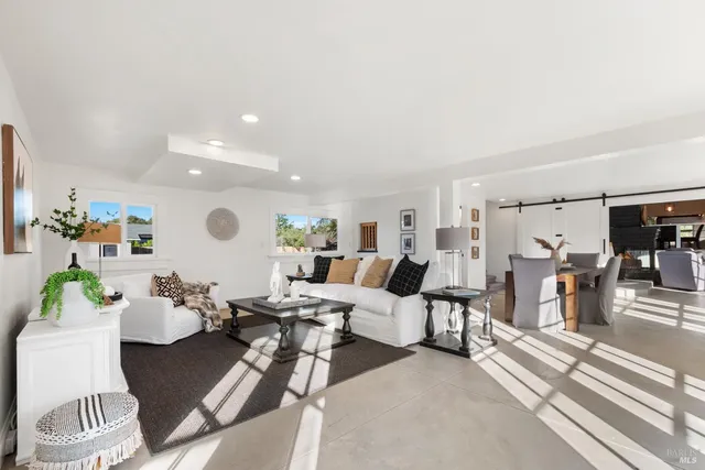 a living room with lots of furniture and a view of living room