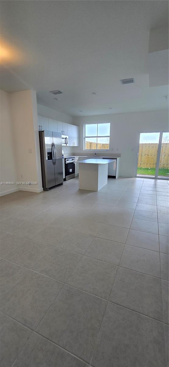 2729 Southeast 26th Road, Unit 2729 Homestead, FL 33035 - Photo 12 of 57 a view of a livingroom with furniture and window