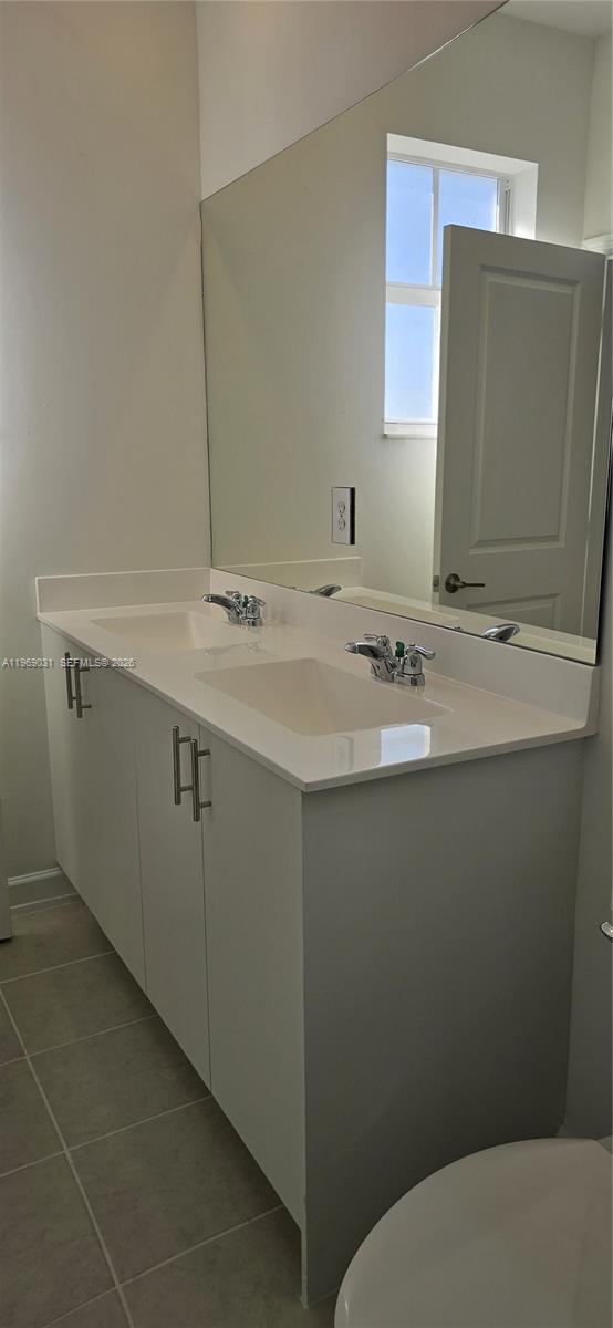 2729 Southeast 26th Road, Unit 2729 Homestead, FL 33035 - Photo 28 of 57 a bathroom with a sink toilet and mirror