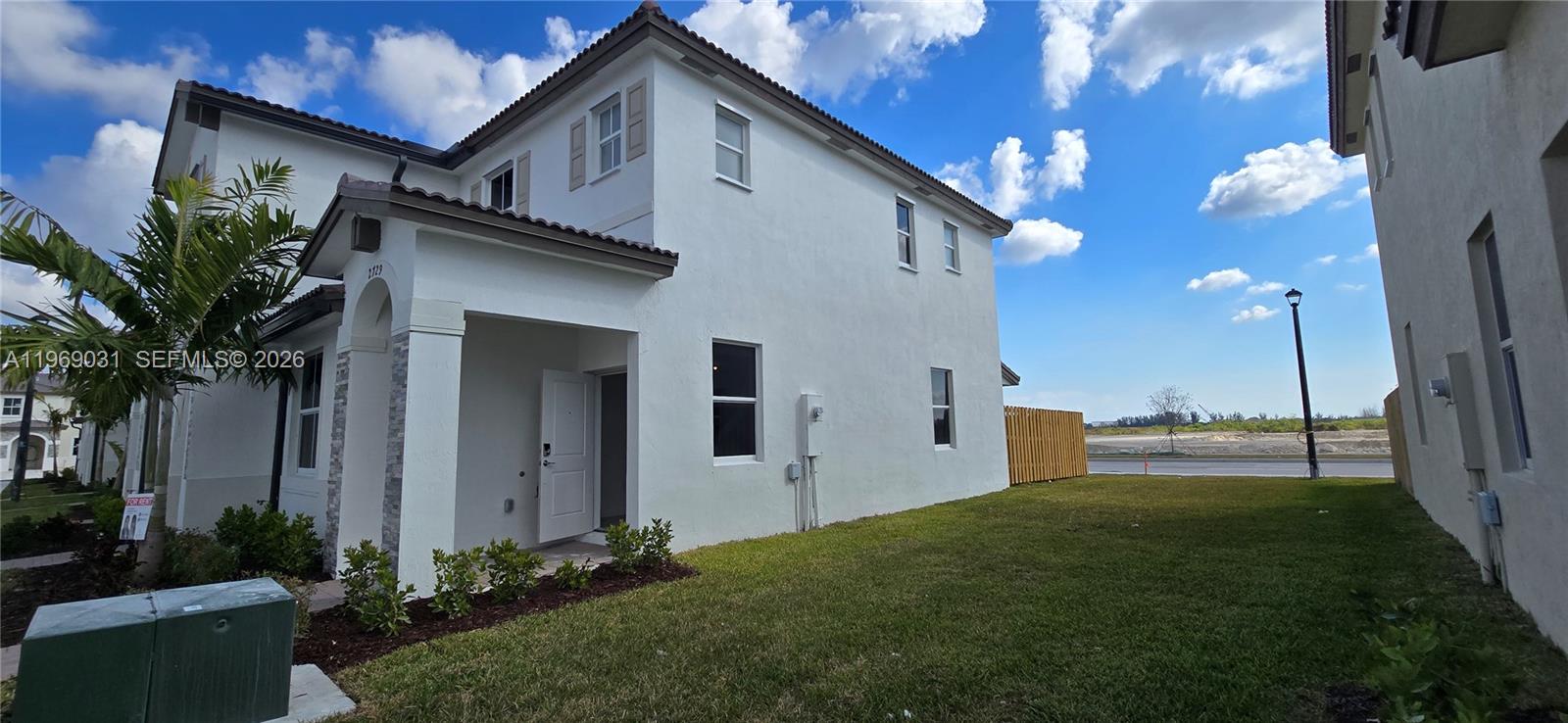 2729 Southeast 26th Road, Unit 2729 Homestead, FL 33035 - Photo 3 of 57 a house view with a garden space