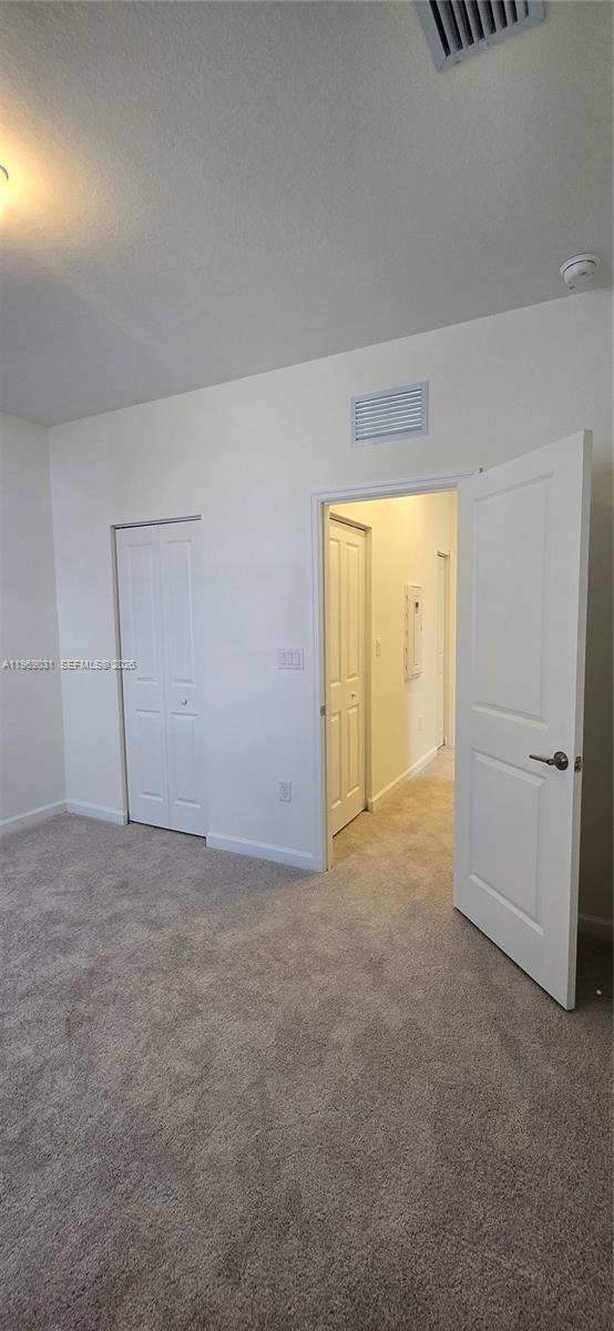 2729 Southeast 26th Road, Unit 2729 Homestead, FL 33035 - Photo 35 of 57 a view of an empty room and a window