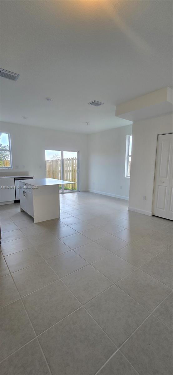 2729 Southeast 26th Road, Unit 2729 Homestead, FL 33035 - Photo 41 of 57 a view of an empty room with window and wooden floor