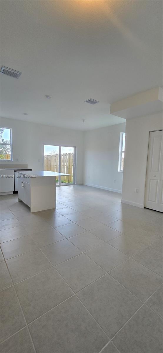 2729 Southeast 26th Road, Unit 2729 Homestead, FL 33035 - Photo 42 of 57 a view of empty room with wooden floor and fan