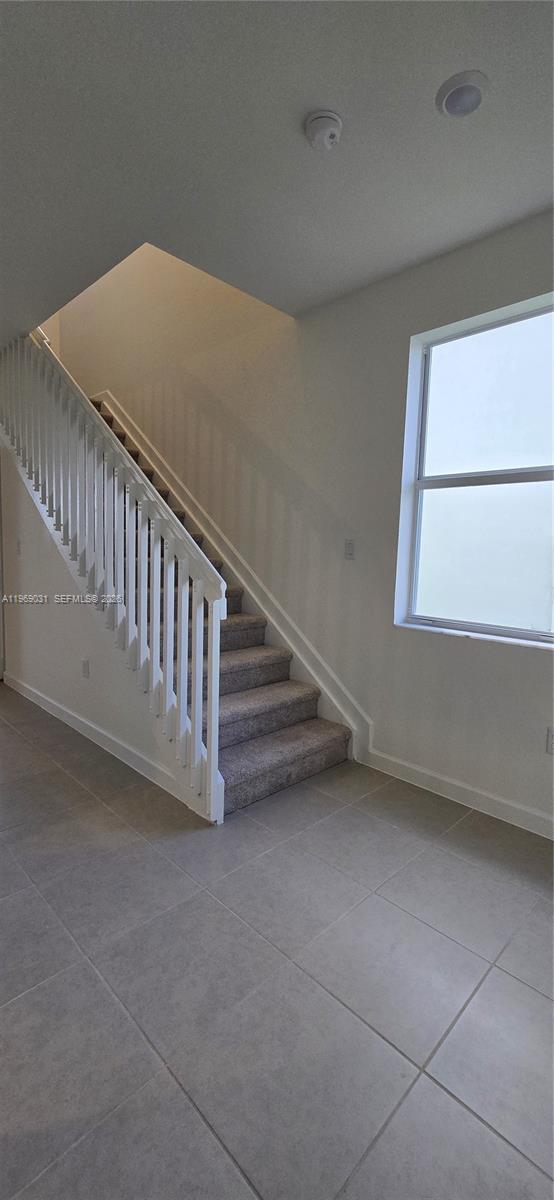 2729 Southeast 26th Road, Unit 2729 Homestead, FL 33035 - Photo 44 of 57 a view of a hallway with staircase