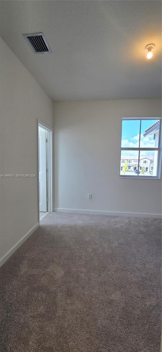 2729 Southeast 26th Road, Unit 2729 Homestead, FL 33035 - Photo 45 of 57 an empty room with windows and closet