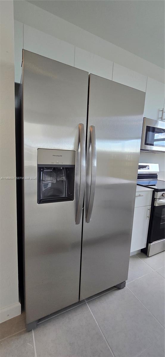 2729 Southeast 26th Road, Unit 2729 Homestead, FL 33035 - Photo 48 of 57 a view of a refrigerator in a kitchen