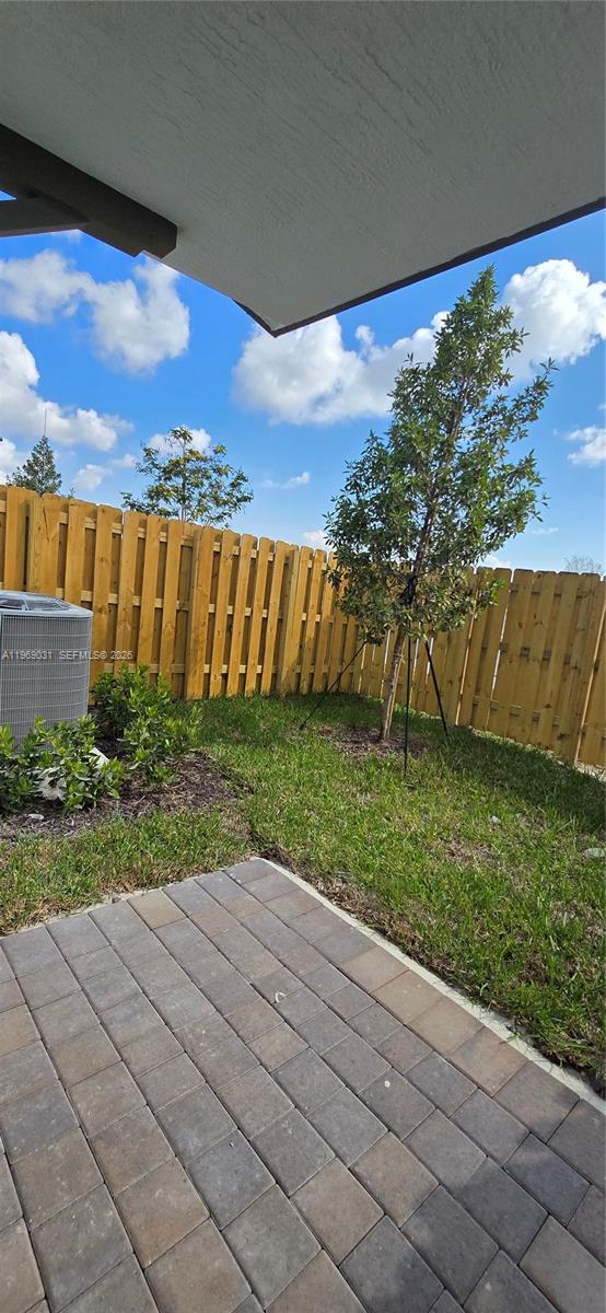 2729 Southeast 26th Road, Unit 2729 Homestead, FL 33035 - Photo 53 of 57 a view of swimming pool with outdoor seating and yard in back