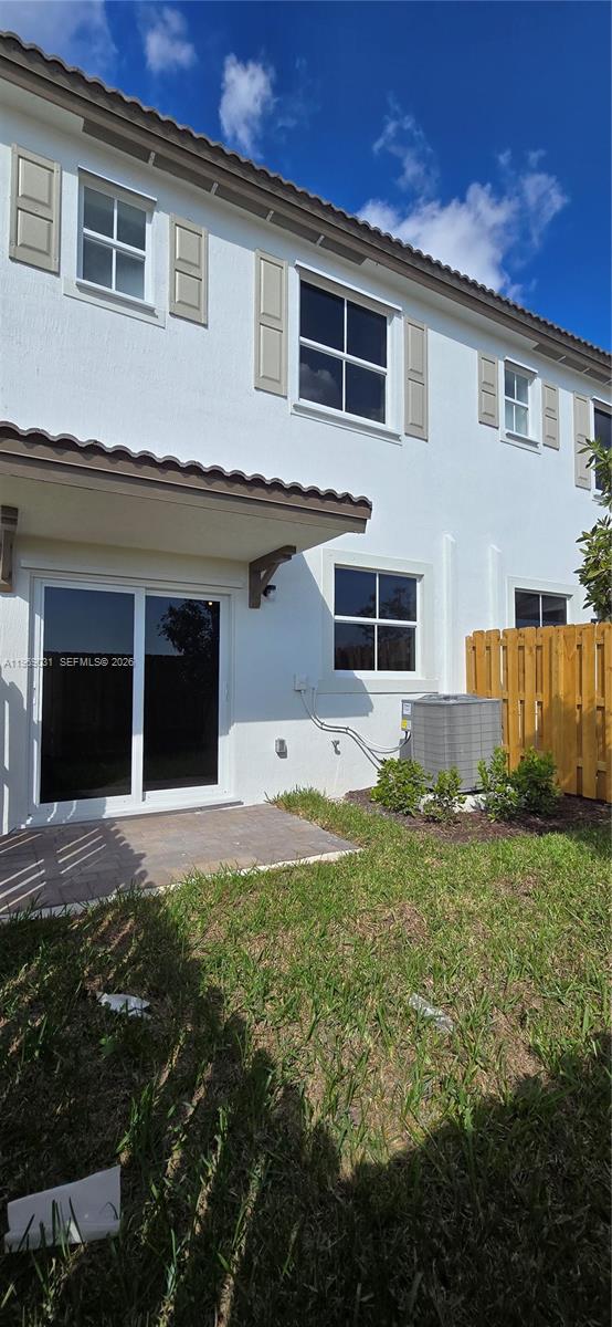 2729 Southeast 26th Road, Unit 2729 Homestead, FL 33035 - Photo 55 of 57 a front view of a house with a yard