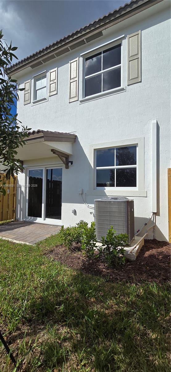 2729 Southeast 26th Road, Unit 2729 Homestead, FL 33035 - Photo 56 of 57 a front view of a house with a yard