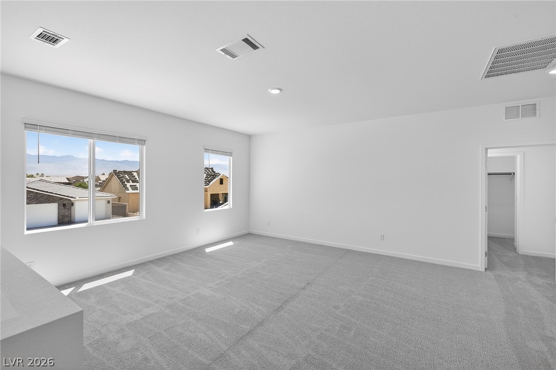 347 Sam Way Mesquite, NV 89027 - Photo 14 of 32 Bright and airy, this room provides a peaceful retreat with soft carpeting and natural light.