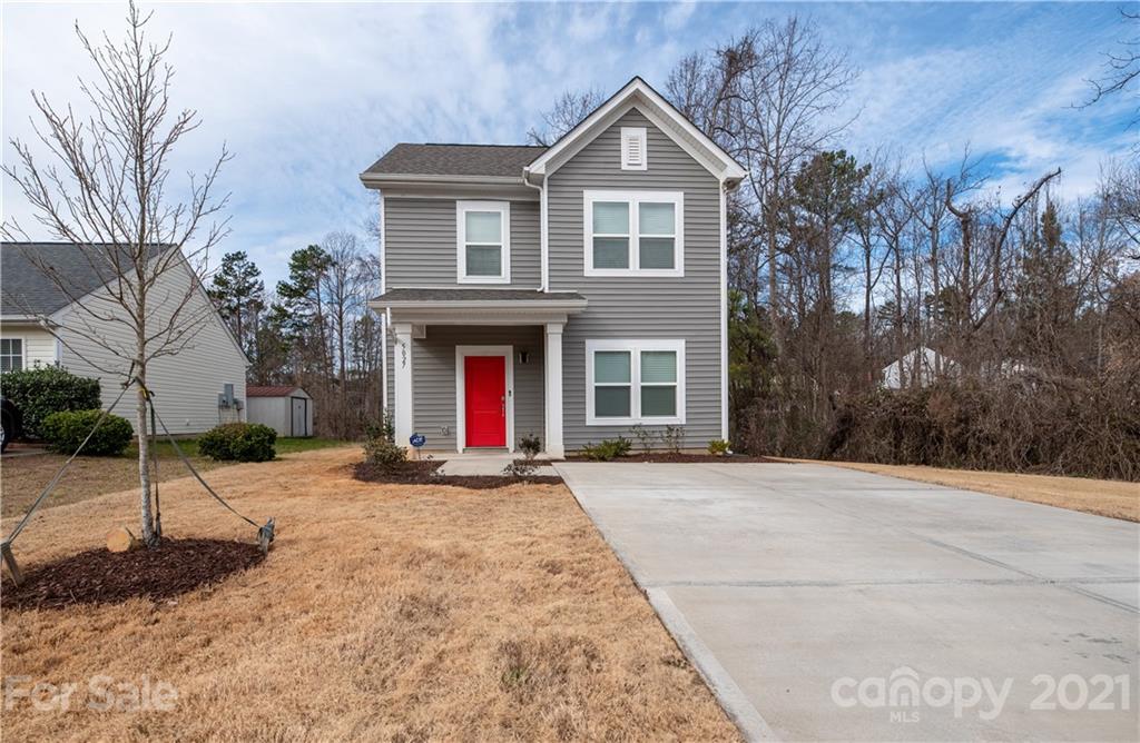5027 Elizabeth Road Charlotte, NC 28269 - Photo 2 of 23 a front view of a house with a yard and garage