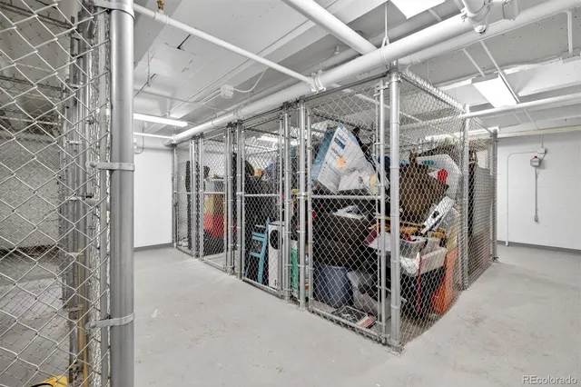 a front view of a building with street view and trees