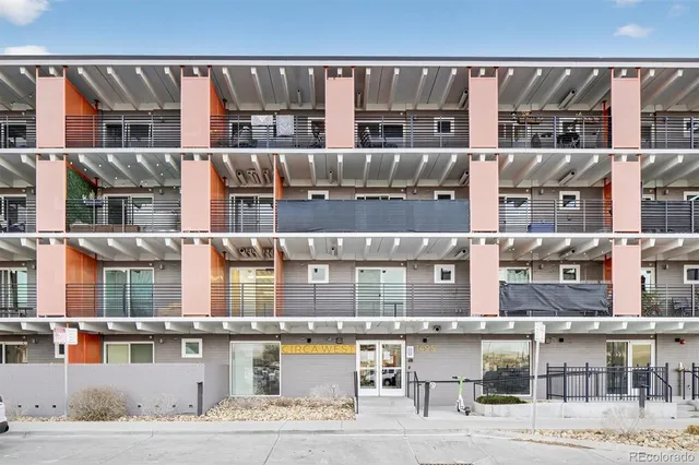 a view of a building with a yard