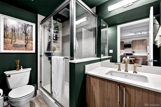 a bathroom with a sink vanity and a mirror