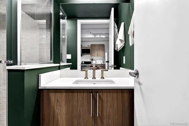 a kitchen that has a sink and a stove in it