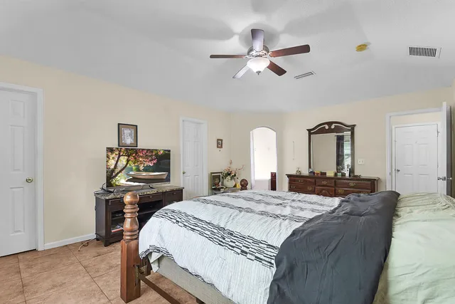 a bedroom with a bed and a table in it