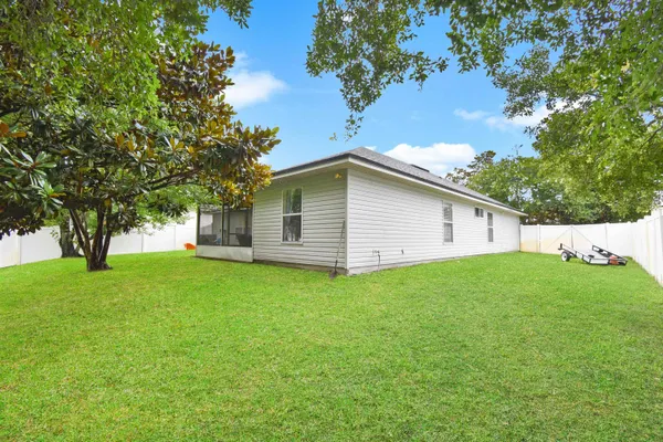 a backyard of a house with lots of green space