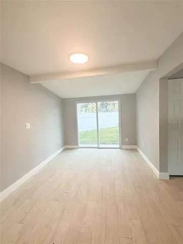 a view of an empty room with a window