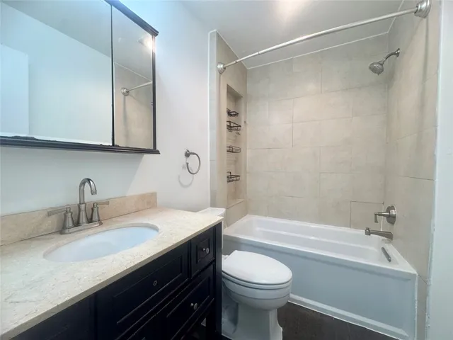 a bathroom with a sink a toilet and a bathtub