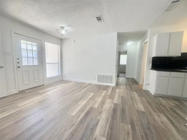 a view of a livingroom with wooden floor