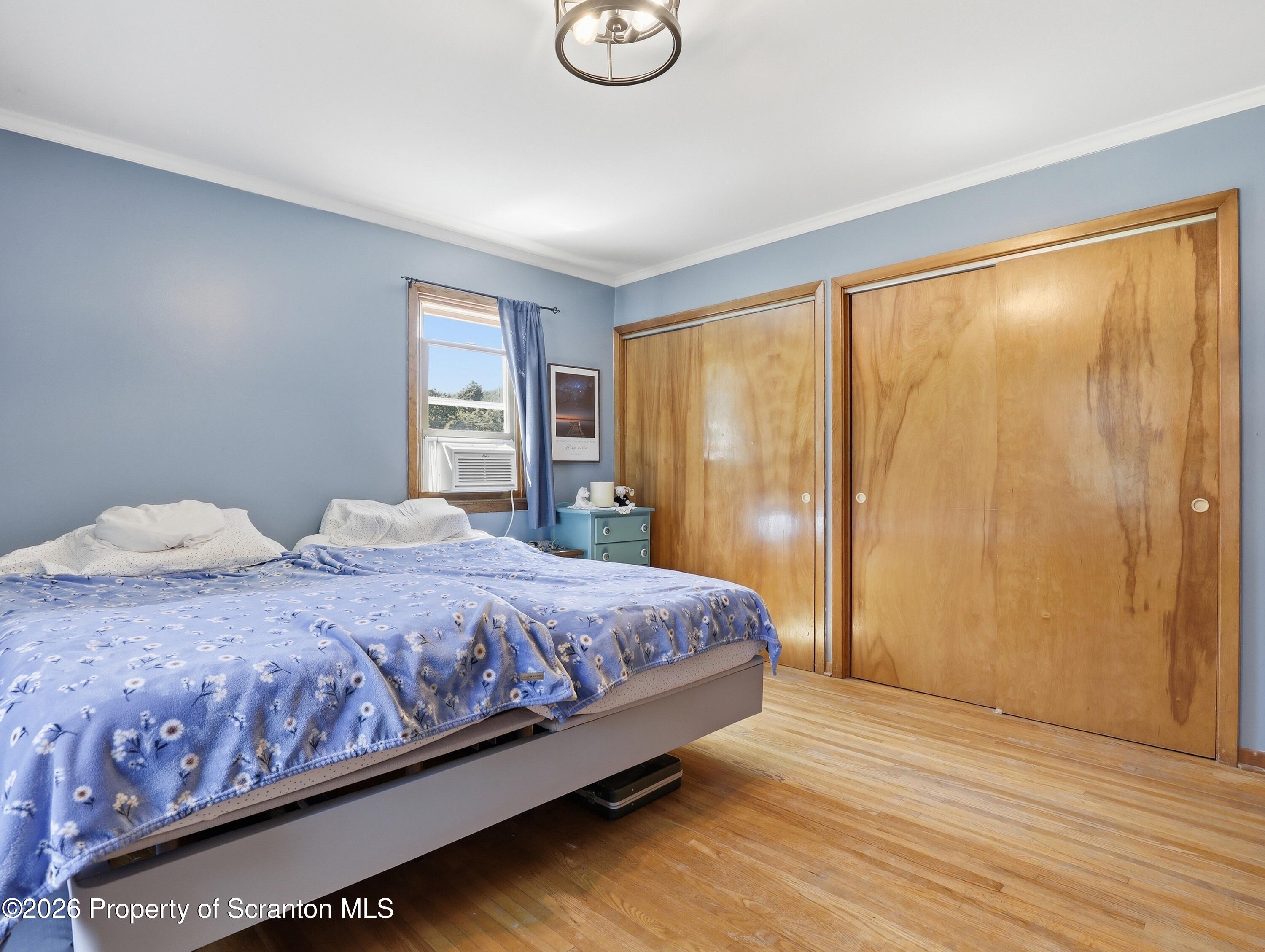 1237 Heart Lake Road Scott Township, PA 18433 - Photo 13 of 39 a bedroom with a large bed and a large window