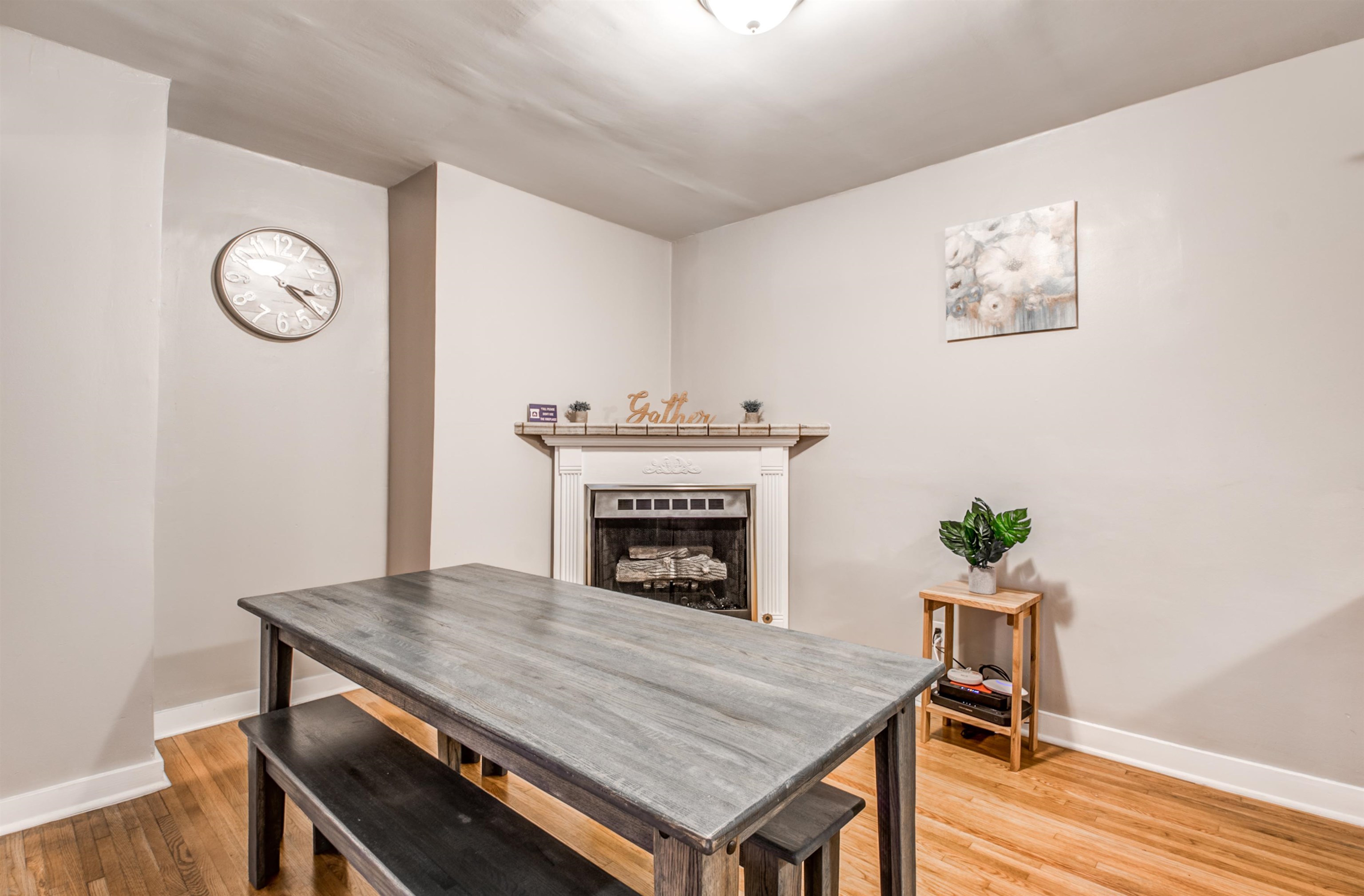 4850 Flamingo Road Memphis, TN 38117 - Photo 12 of 40 Dining room featuring light wood finished floors and a fireplace
