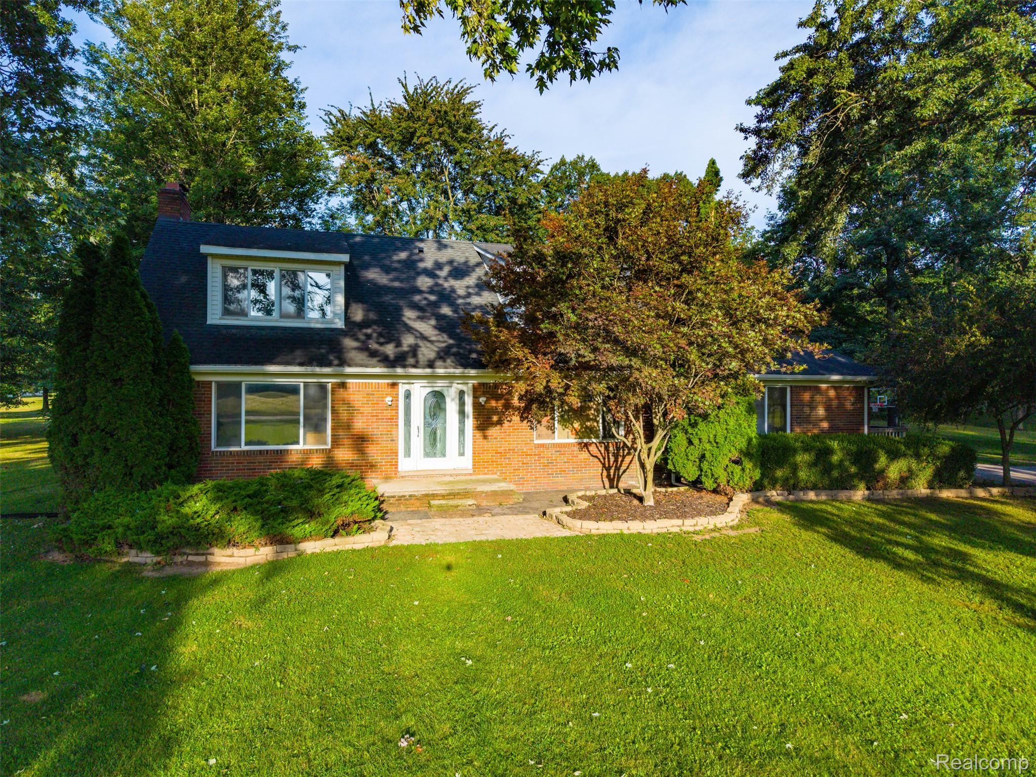 26516 Romine Road New Boston, MI 48164 - Photo 48 of 62 Brick exterior with dark roof and white trim