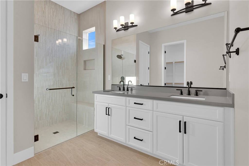 3731 Siembra Road Paso Robles, CA 93446 - Photo 13 of 21 a bathroom with a granite countertop sink two mirror and shower