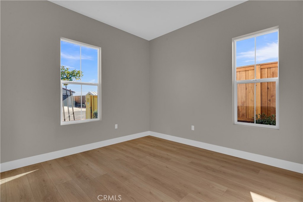 3731 Siembra Road Paso Robles, CA 93446 - Photo 14 of 21 a view of an empty room with wooden floor and a window