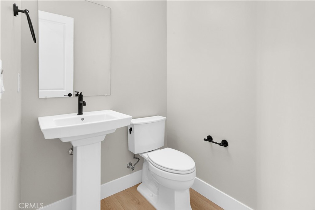 3731 Siembra Road Paso Robles, CA 93446 - Photo 18 of 21 a bathroom with a sink a toilet and mirror