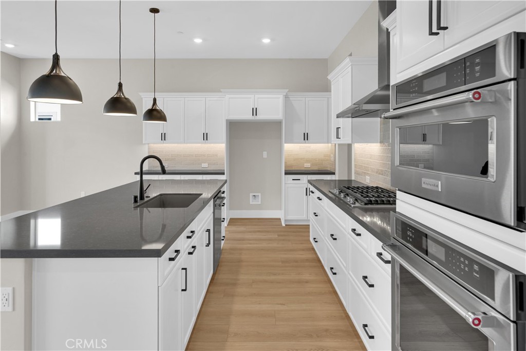3731 Siembra Road Paso Robles, CA 93446 - Photo 3 of 21 a kitchen with stainless steel appliances granite countertop a sink a stove and a refrigerator