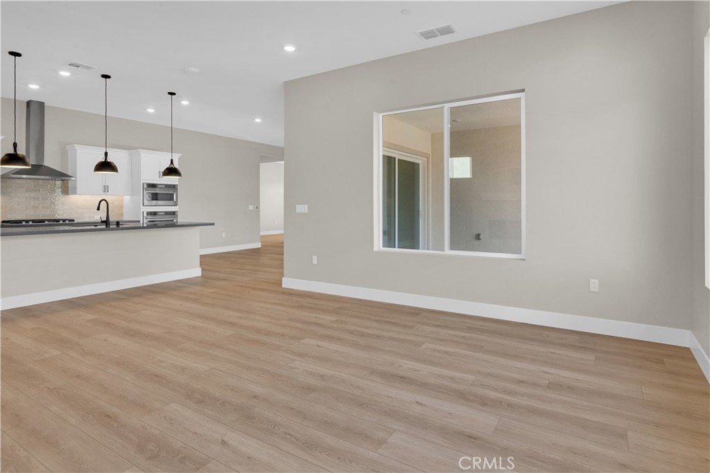 3731 Siembra Road Paso Robles, CA 93446 - Photo 5 of 21 a view of a kitchen with kitchen island a sink stainless steel appliances and cabinets
