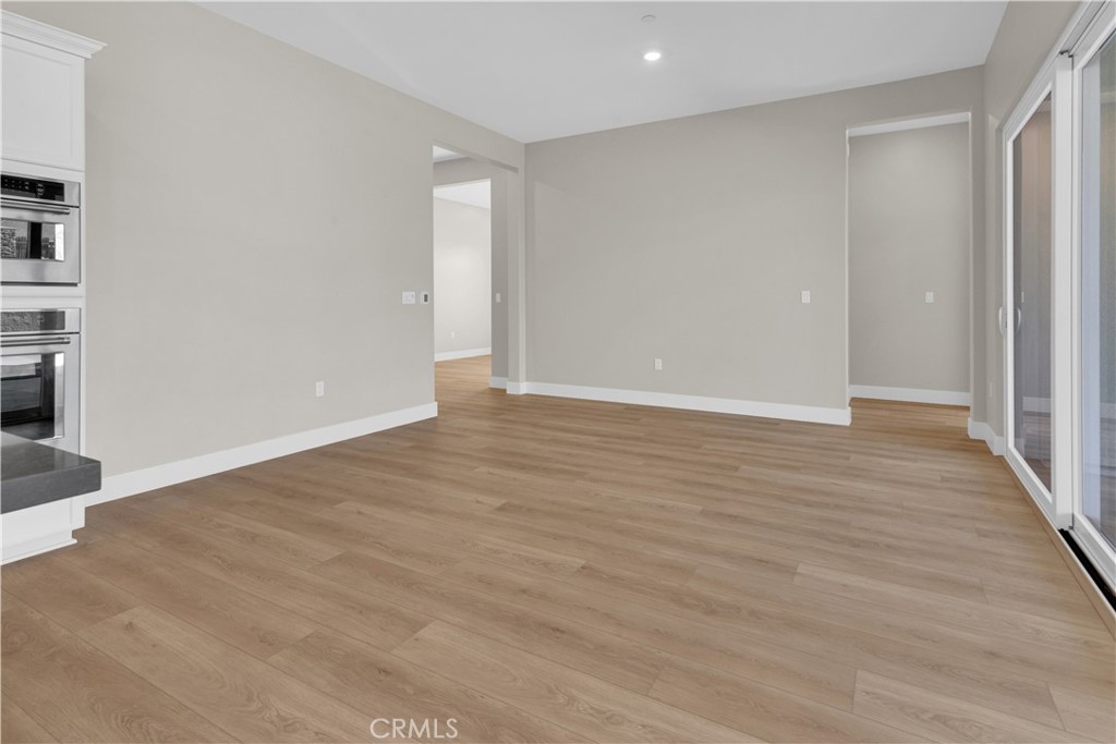 3731 Siembra Road Paso Robles, CA 93446 - Photo 6 of 21 a view of an empty room with wooden floor and a window